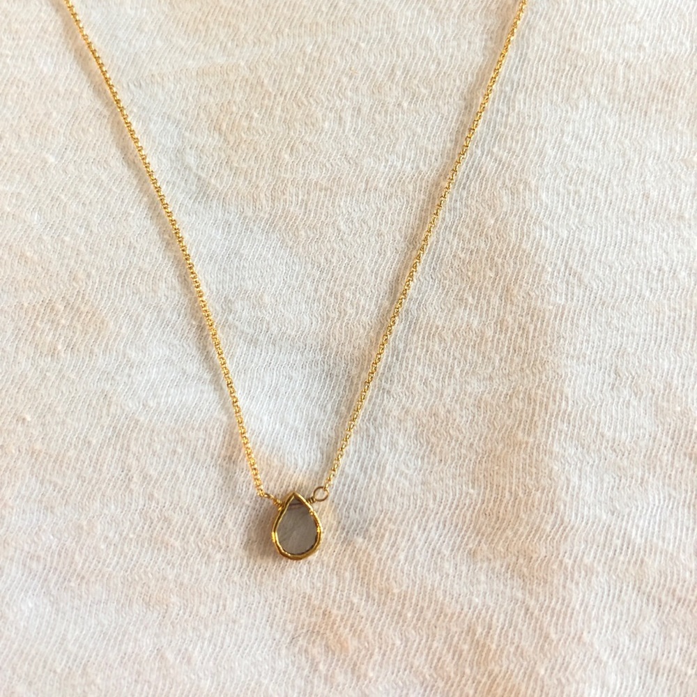 gold necklace with clear teardrop pendant